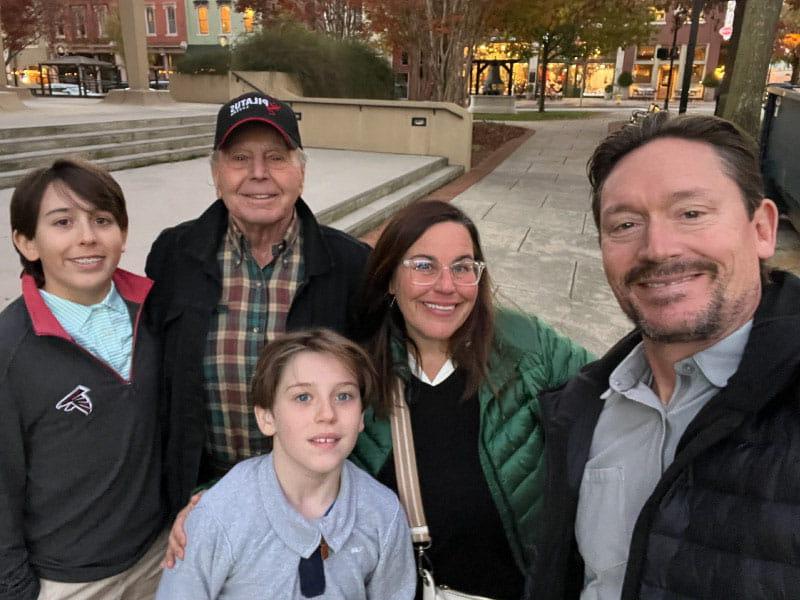 Becky Engram, second from left, with husband Derek, left, her father, Bruce Dunning, and sons Carter and Hudson, right, around Thanksgiving last year. Engram is part of the sandwich caregiver generation, being a parent to her boys while also caring for Dunning, who has heart issues.